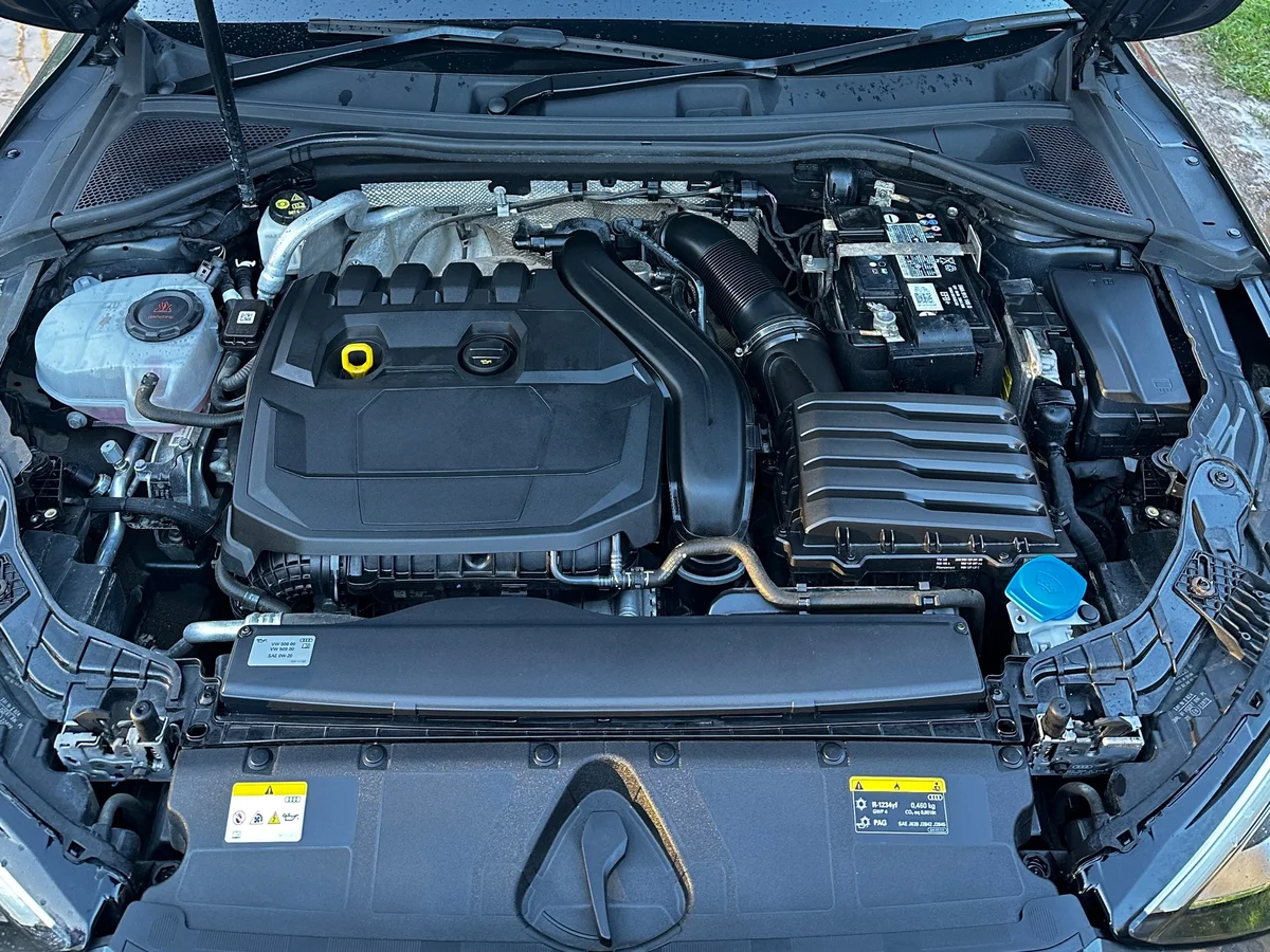 After: Engine bay clean by JJ Valets on an Audi: dusty, dirty engine bay before and clean, dressed engine bay after