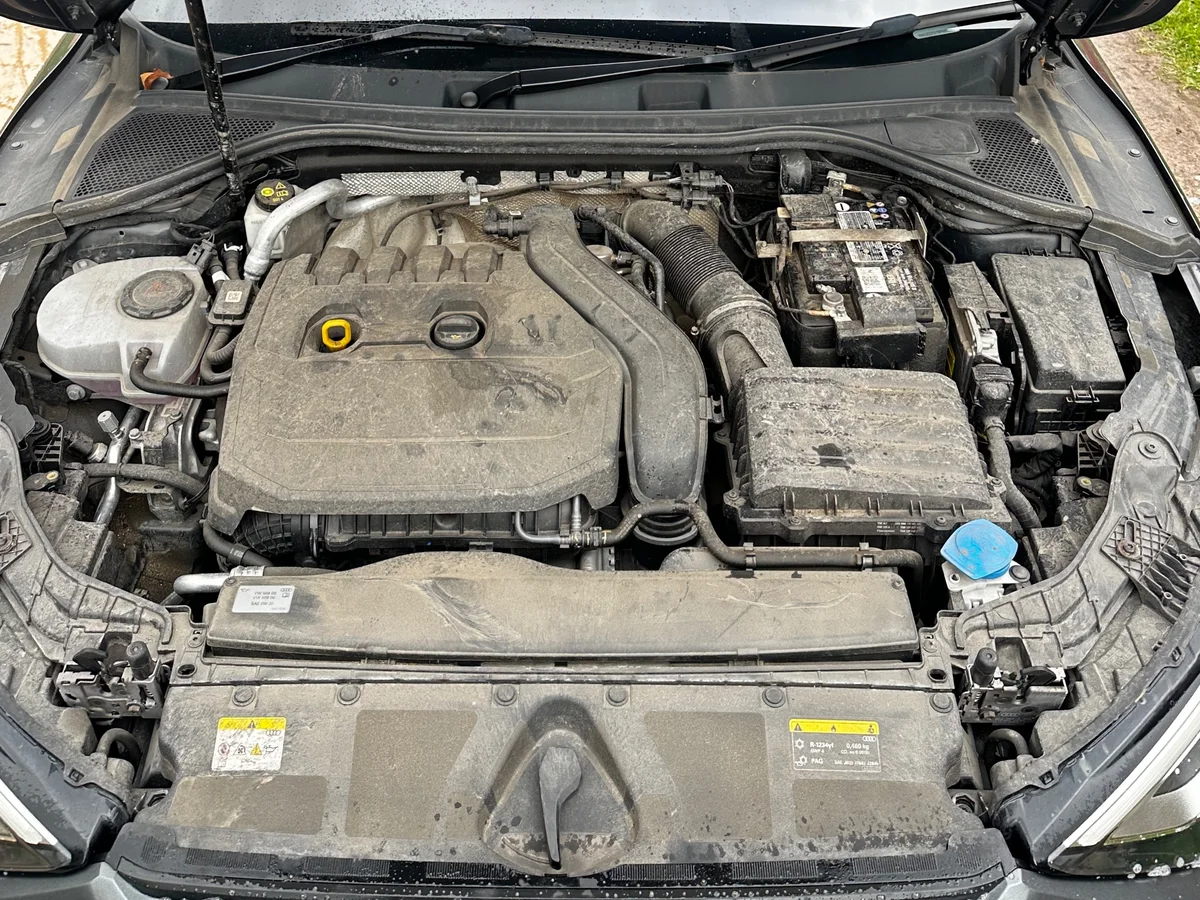 Before: Engine bay clean by JJ Valets on an Audi: dusty, dirty engine bay before and clean, dressed engine bay after